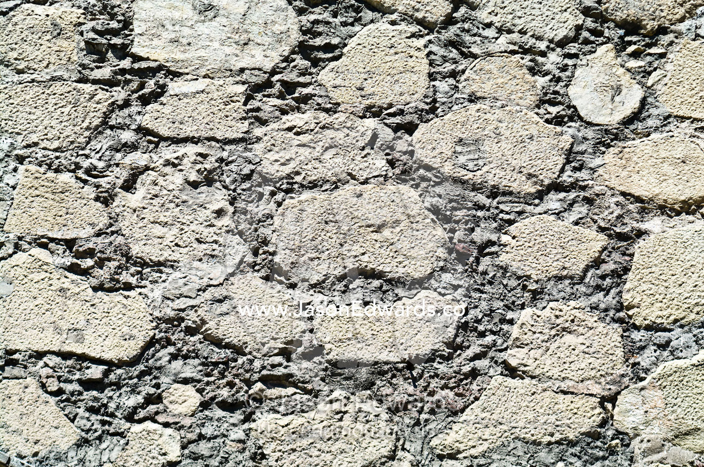 Detail of a stone wall at the entrance to an ancient Christian church. Iglesia San Francisco, Santiago, Chile