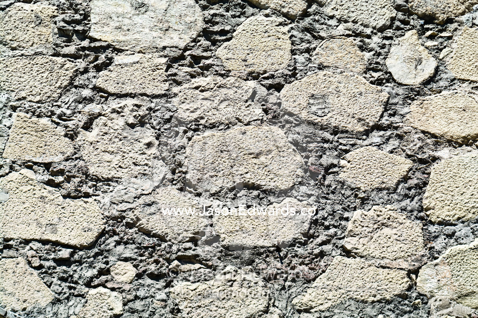 Detail of a stone wall at the entrance to an ancient Christian church. Iglesia San Francisco, Santiago, Chile