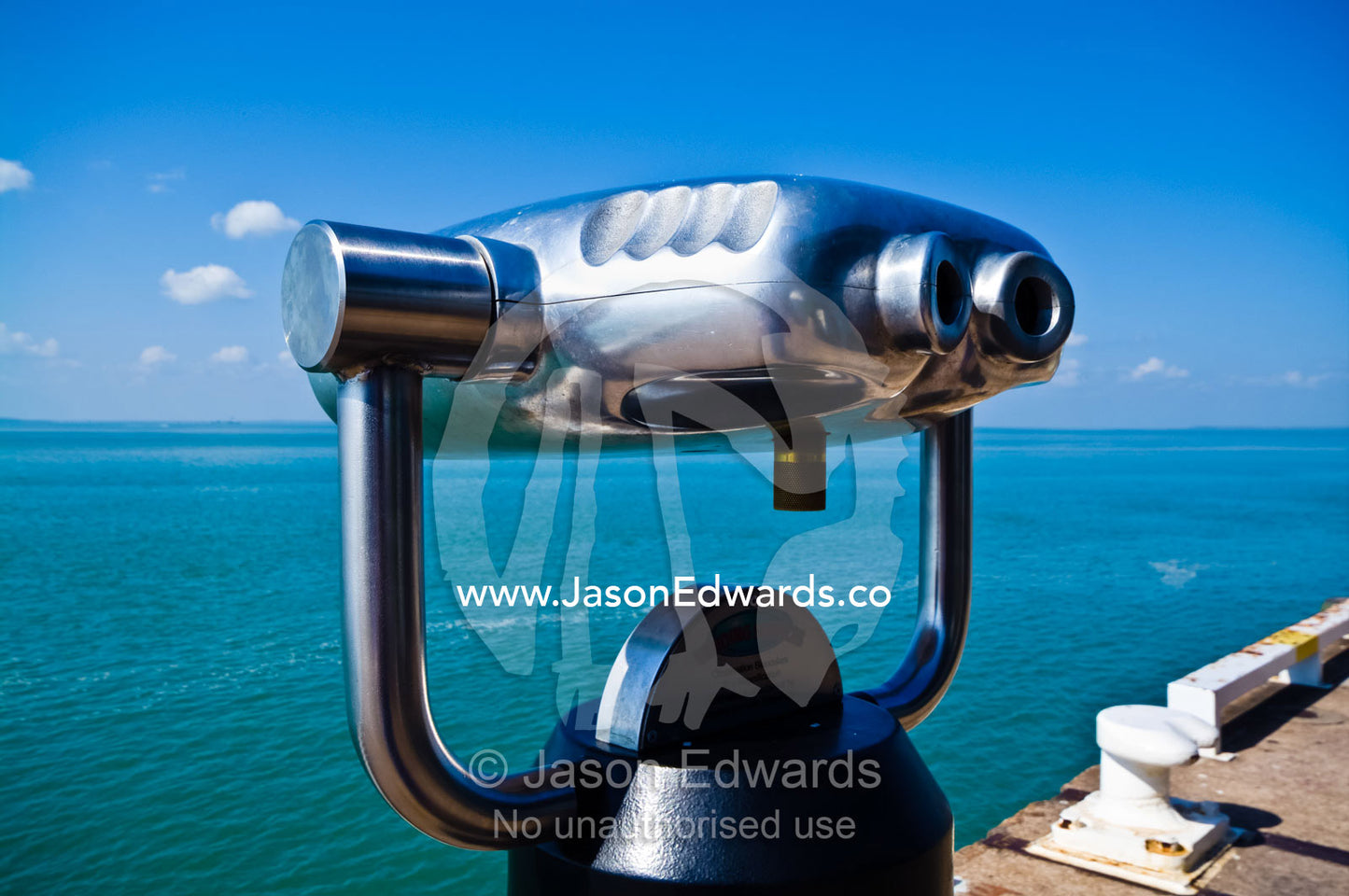 Chrome stainless steel binoculars enable tourists to view the ocean. Darwin Waterfront, Darwin, Northern Territory, Australia