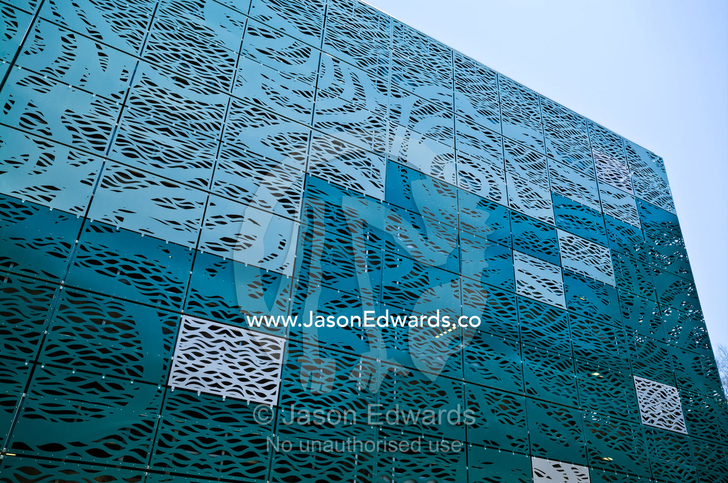 Square panels of an architecturally designed pressed metal wall. Darwin Waterfront, Darwin, Northern Territory, Australia