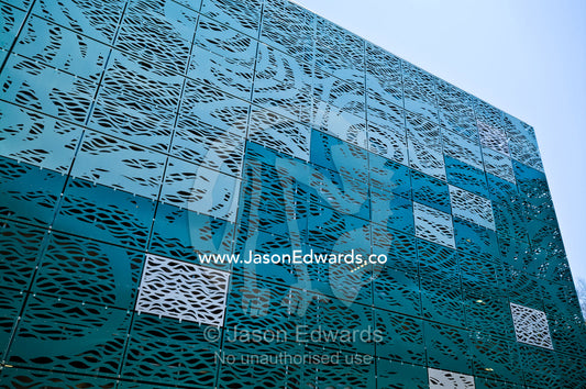 Square panels of an architecturally designed pressed metal wall. Darwin Waterfront, Darwin, Northern Territory, Australia