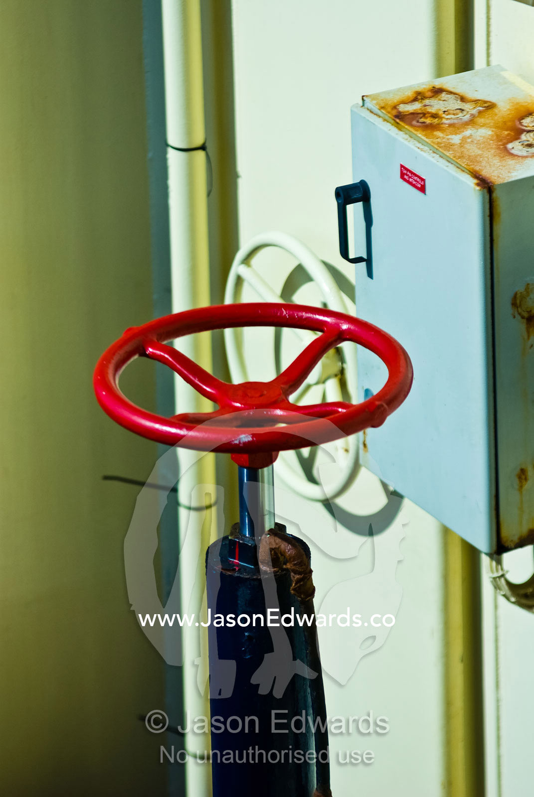 A bright red steering wheel at the rear of a tugboat for stern control Darwin Waterfront, Darwin, Northern Territory, Australia
