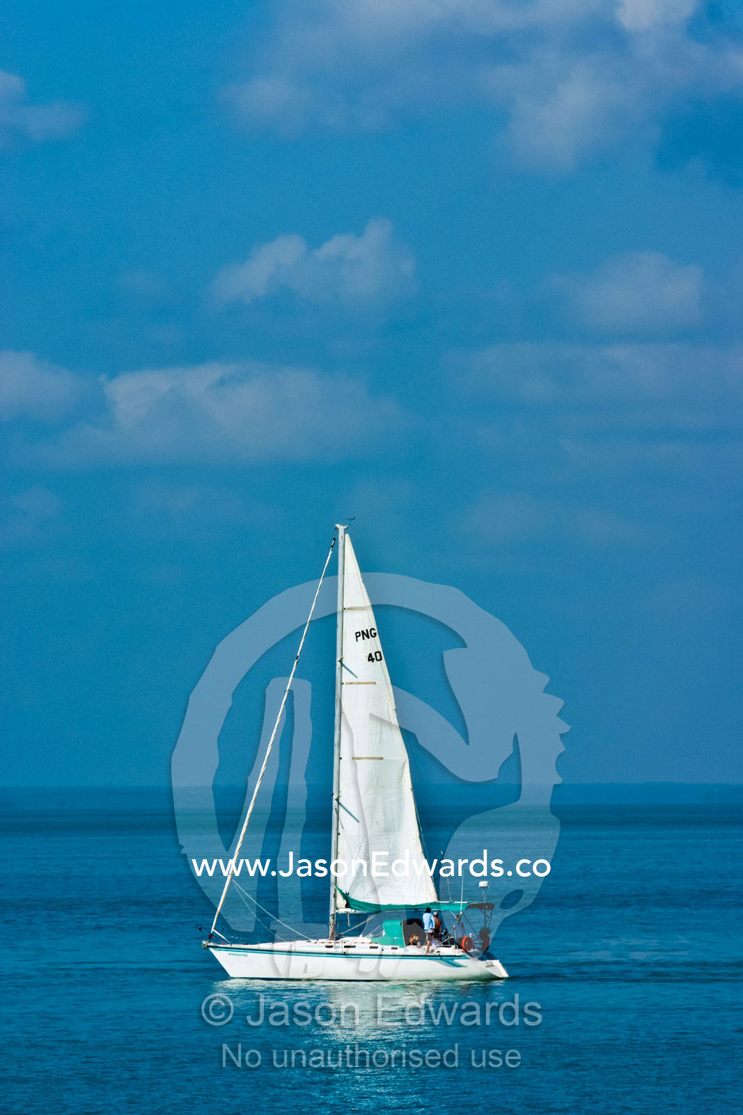 A white yacht sails the calm turquoise waters of the Arafura Sea. Arafura Sea, Darwin, Northern Territory, Australia