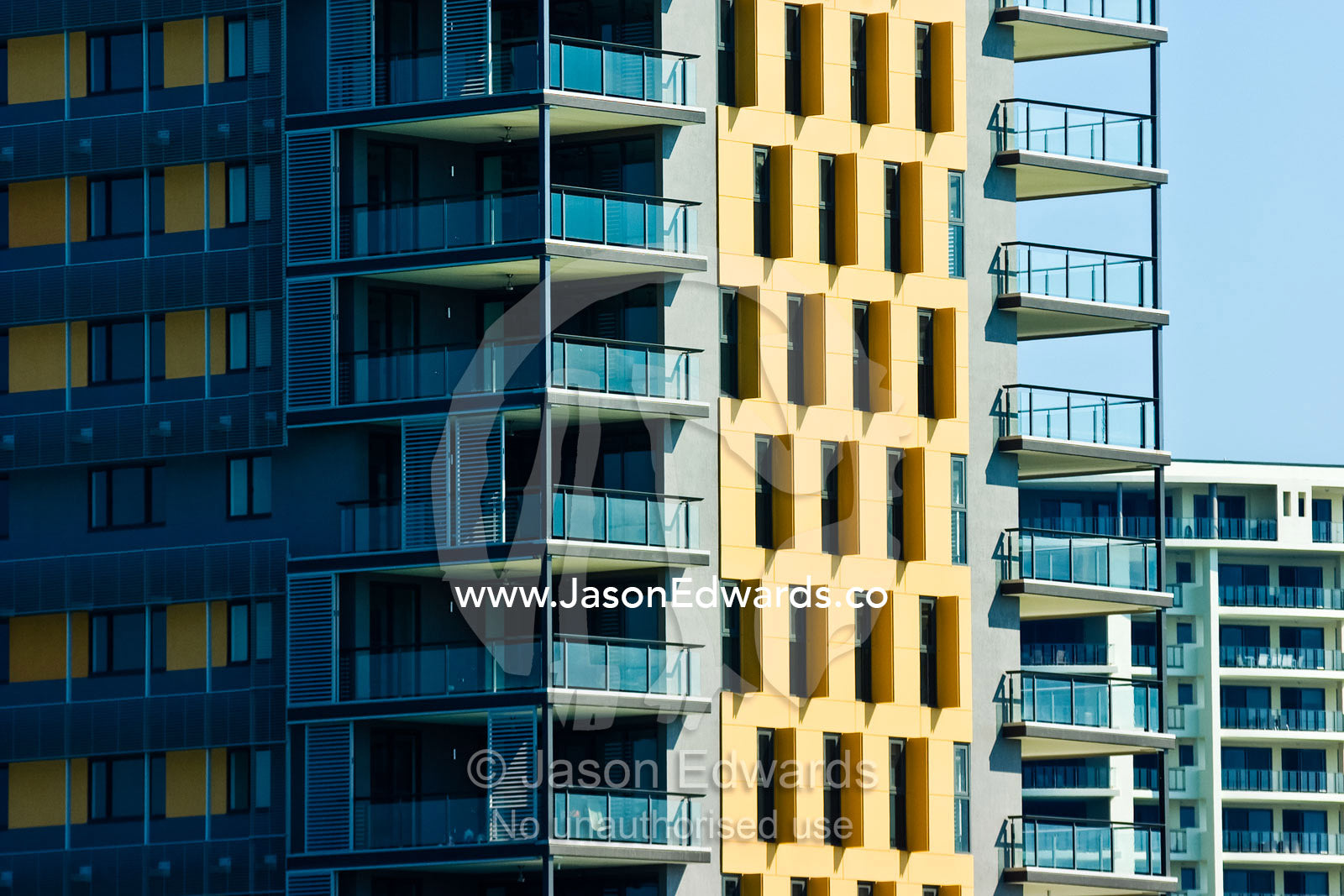 Balconies and windows in an apartment complex overlooking the sea. Darwin Waterfront, Darwin, Northern Territory, Australia