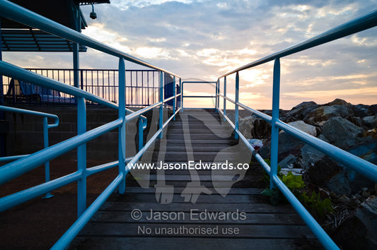 A boardwalk and safety rails lead to a ferry departure lounge. Cullen Bay, Darwin, Northern Territory, Australia