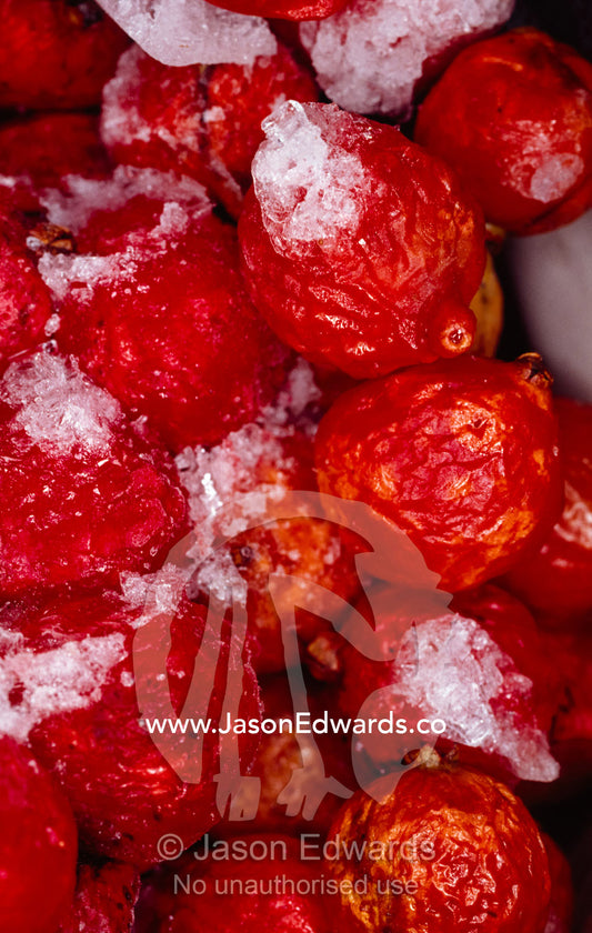 A bag of frozen blood red Riberry in a commercial store deep freeze. Sydney, New South Wales, Australia