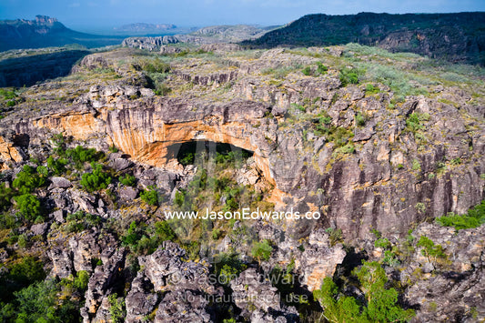 A weathered arch in an escarpment serves as an Aboriginal Sacred Site. The Archway, Arnhem Land Border, Kakadu National Park, Northern Territory, Australia.