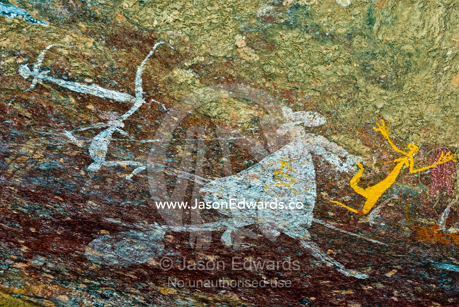 Aboriginal rock art depicts figures hunting a kangaroo with spears. Nourlangie, Nawurlandja, Anbangbang Billabong, Kakadu National Park, Northern Territory, Australia.