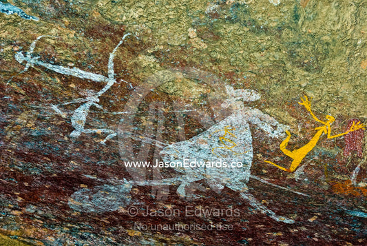 Aboriginal rock art depicts figures hunting a kangaroo with spears. Nourlangie, Nawurlandja, Anbangbang Billabong, Kakadu National Park, Northern Territory, Australia.