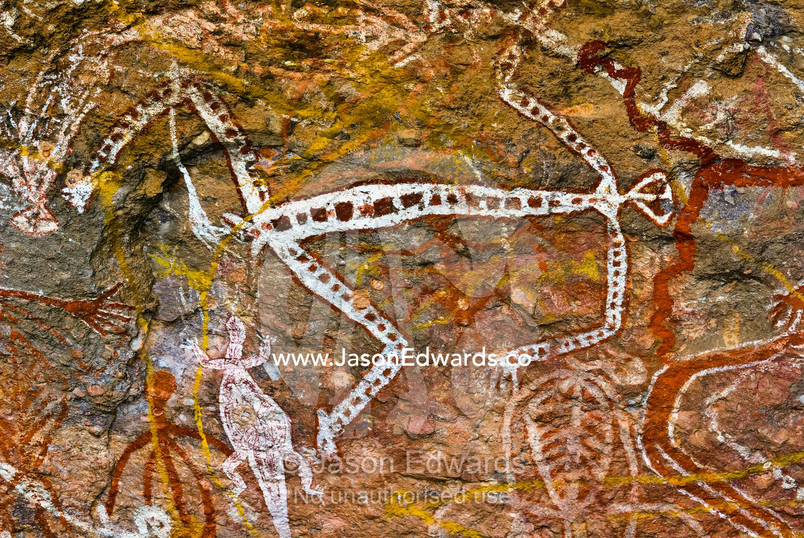 Aboriginal rock art depicts figures of Mimi Spirits on a cave wall. Nourlangie, Nawurlandja, Anbangbang Billabong, Kakadu National Park, Northern Territory, Australia.