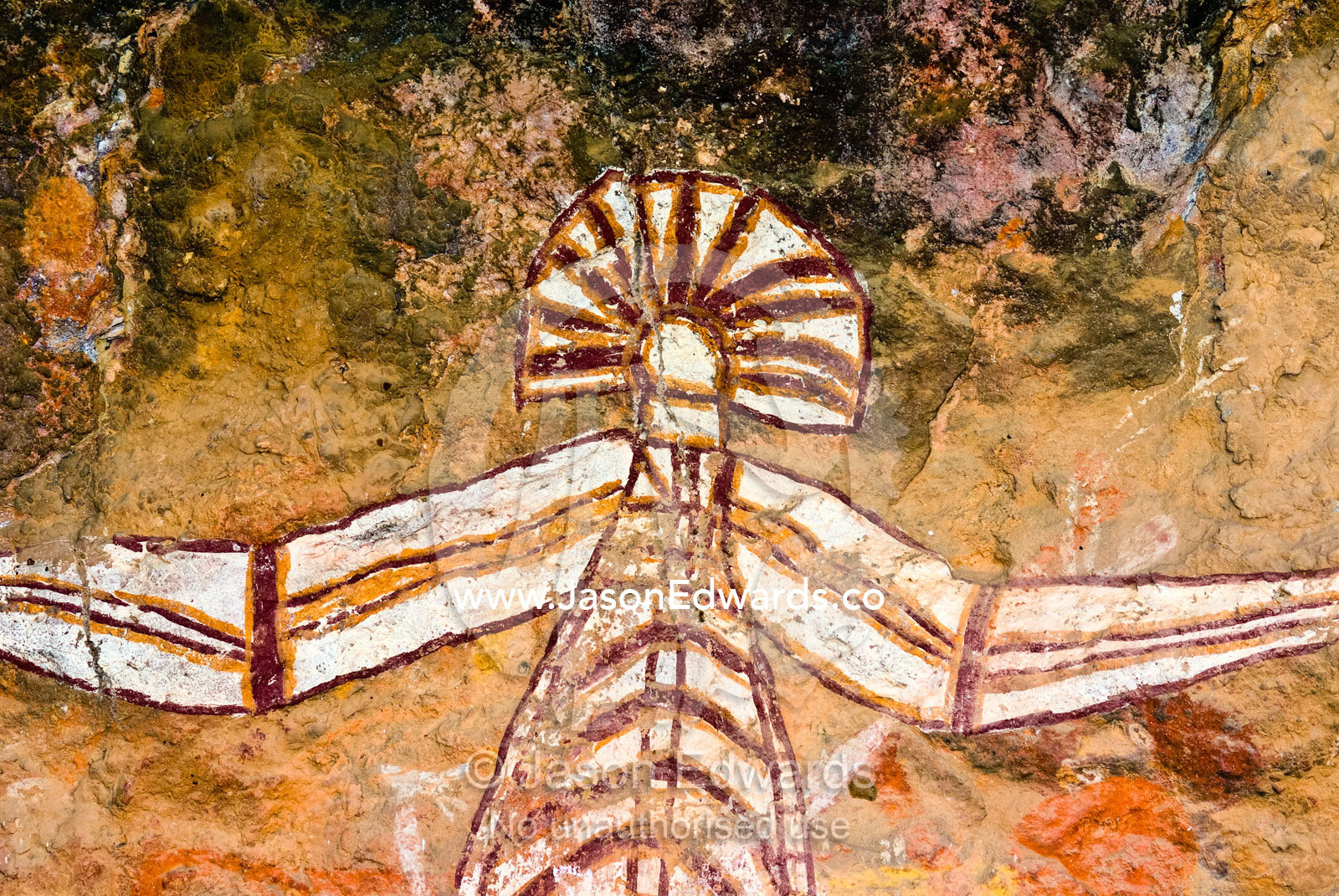 Ancient Aboriginal rock art depicts Nabulwinjbulwinj on a cliff wall. Nourlangie, Nawurlandja, Anbangbang Billabong, Kakadu National Park, Northern Territory, Australia.
