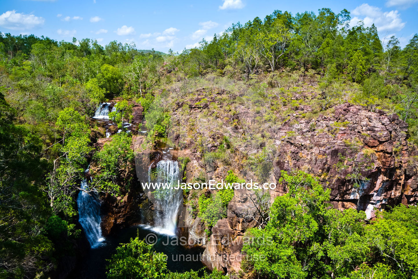 Pristine Florence Falls cascade over a remote sandstone escarpment. Florence Falls, Litchfield National Park, Northern Territory, Australia.