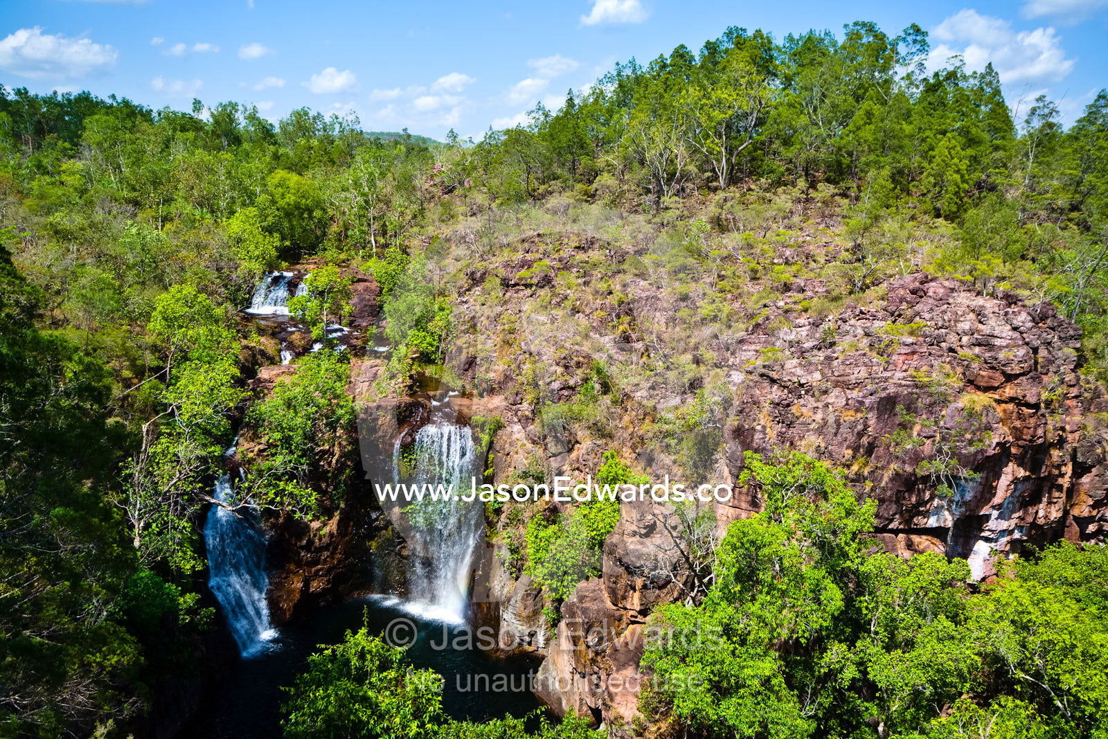 Pristine Florence Falls cascade over a remote sandstone escarpment. Florence Falls, Litchfield National Park, Northern Territory, Australia.