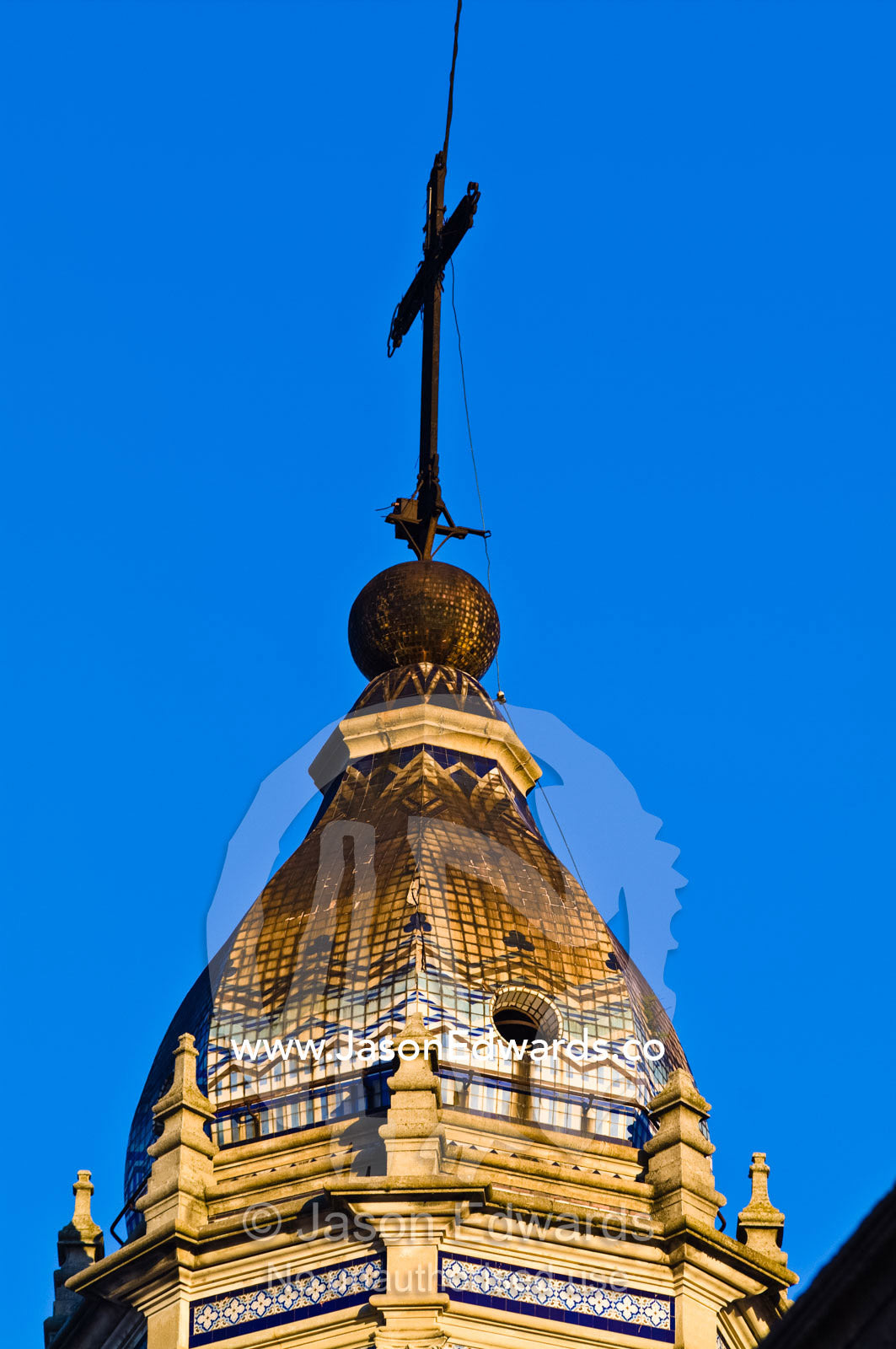A crucifix upon a dome of the Parroquia de San Pedro Telmo church. San Telmo, Buenos Aires, Argentina.