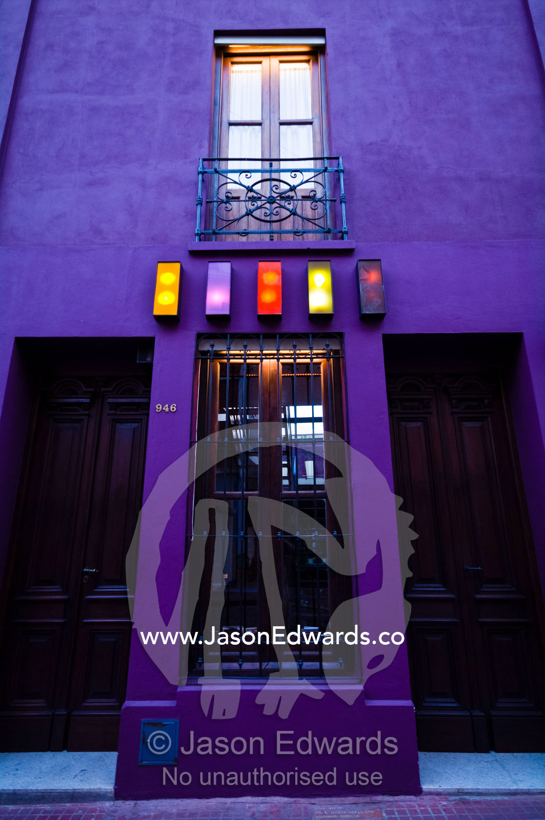The funky purple facade and neon lights of an inner city bar. San Telmo, Buenos Aires, Argentina.