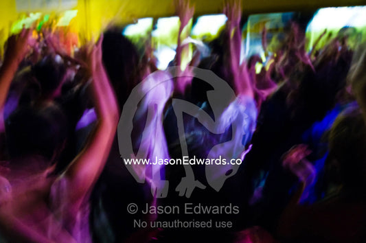 People dance to a percussion band in an inner city night club. La Garufa, Once, Buenos Aires, Argentina.