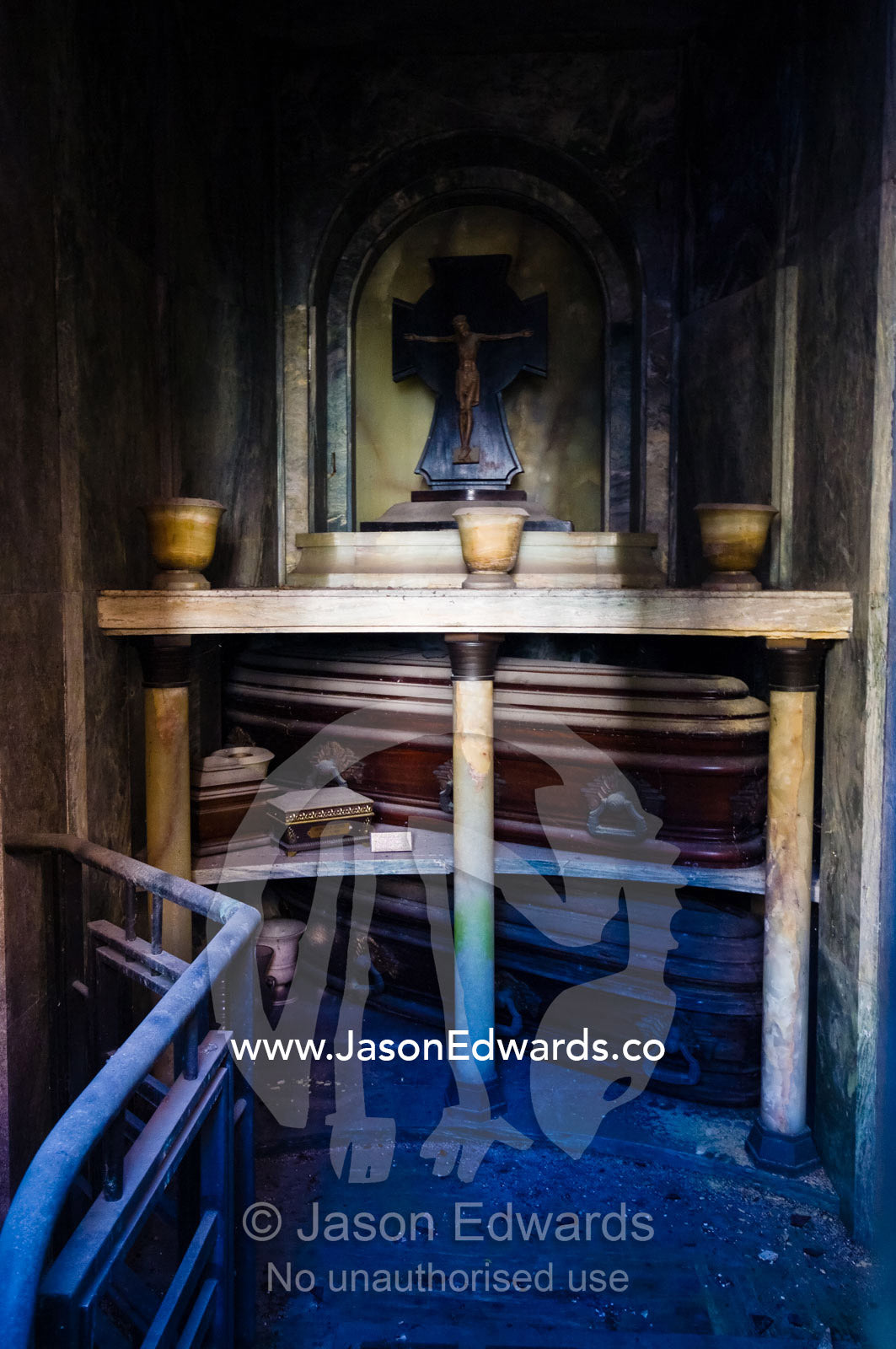 Old dusty coffins in a family mausoleum in a city cemetery. La Recoleta Cemetery, Recoleta, Buenos Aires, Argentina.