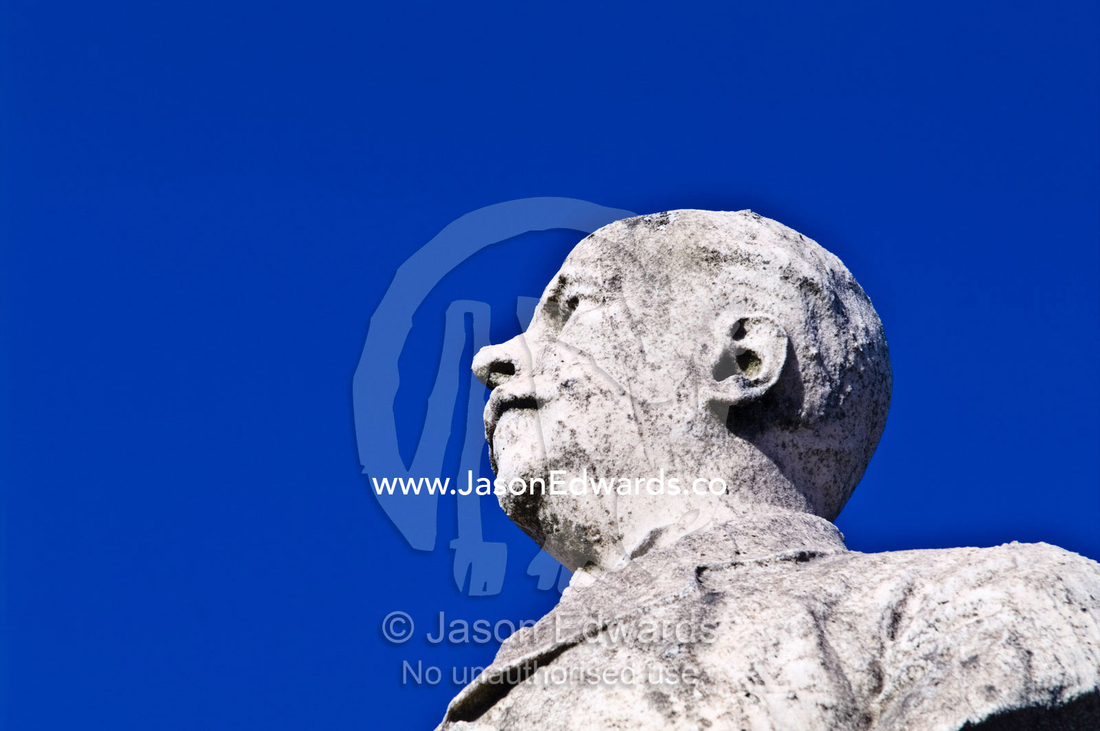 A concrete bust of a dignitary on the roof of a family mausoleum. La Recoleta Cemetery, Recoleta, Buenos Aires, Argentina.