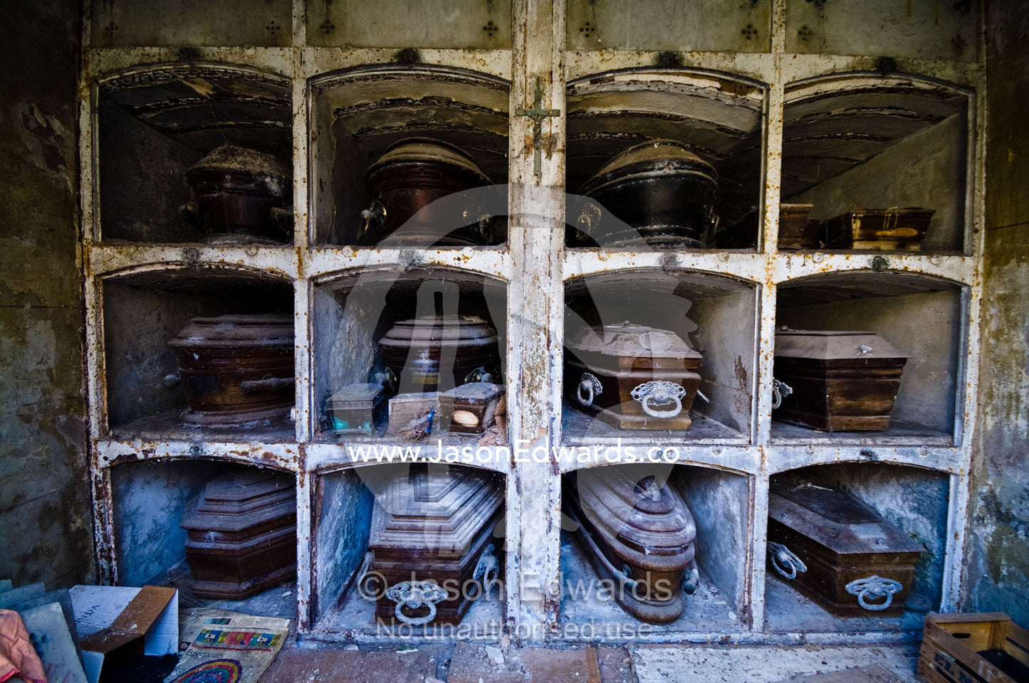 Old dusty coffins in a family mausoleum in a city cemetery. La Recoleta Cemetery, Recoleta, Buenos Aires, Argentina.