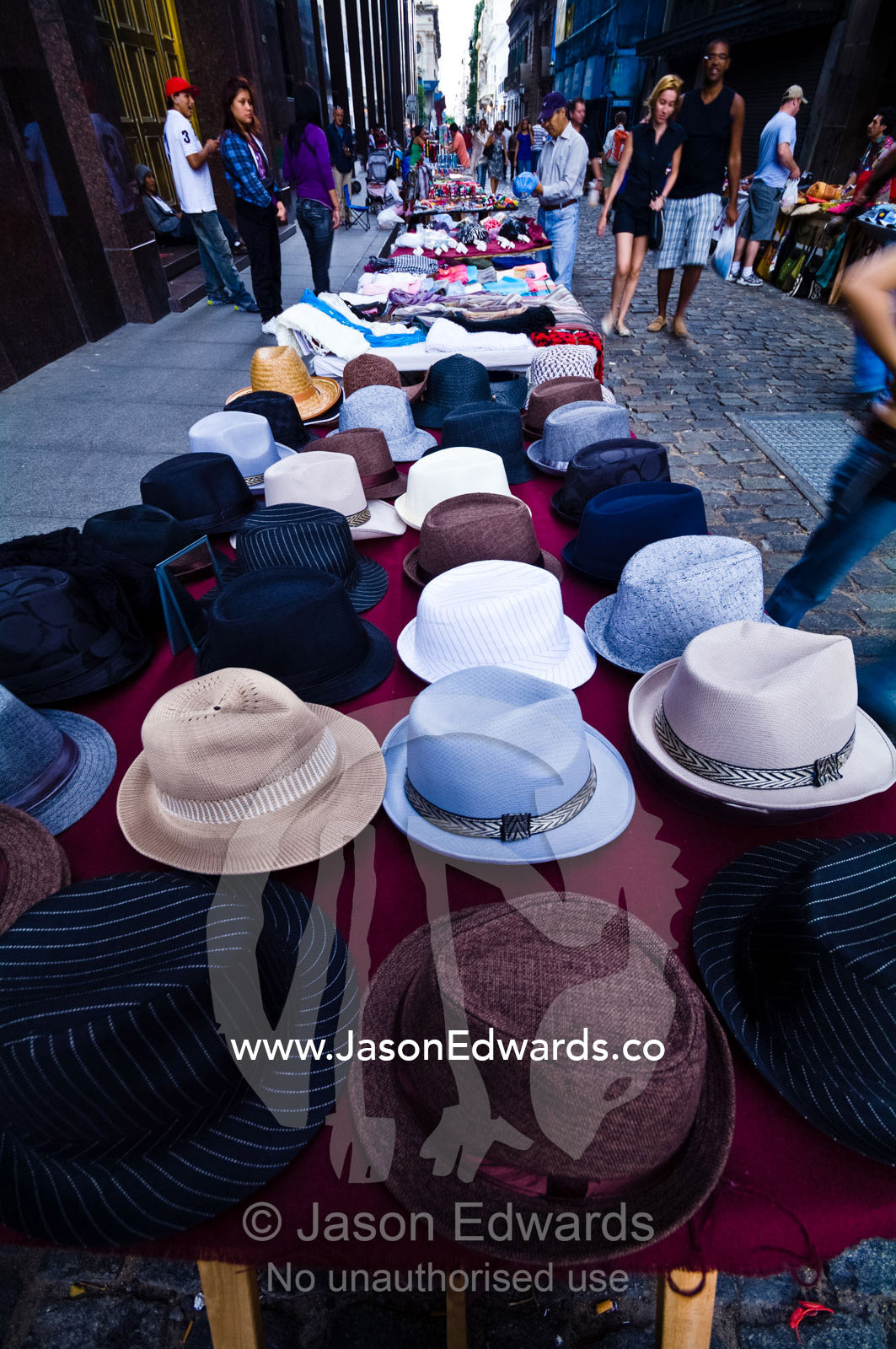 Tango hats for sale in a market stall in a cobblestone city lane. Plaza de Mayo, Buenos Aires, Argentina.