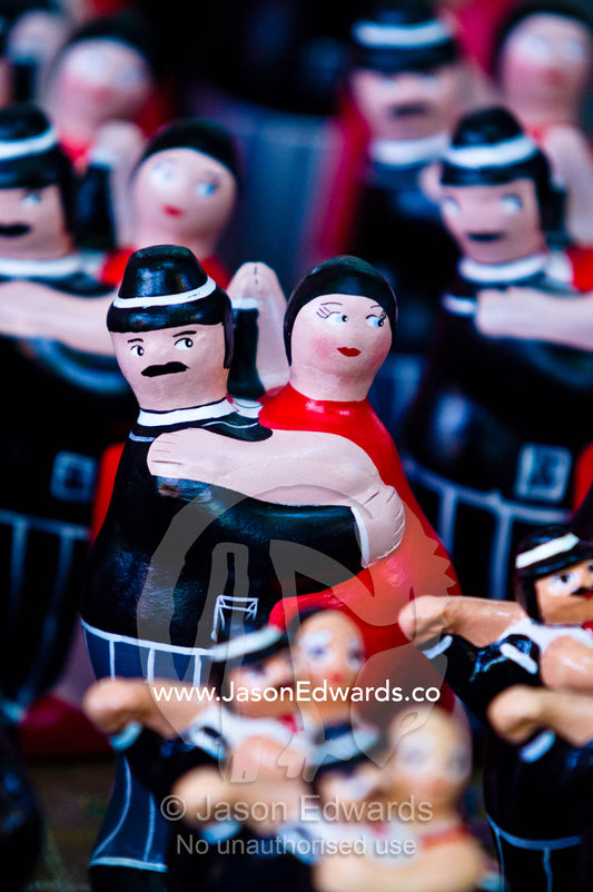 Wooden souvenir dolls show a couple Tango dancing sell to tourists. El Caminito, La Boca, Buenos Aires, Argentina.