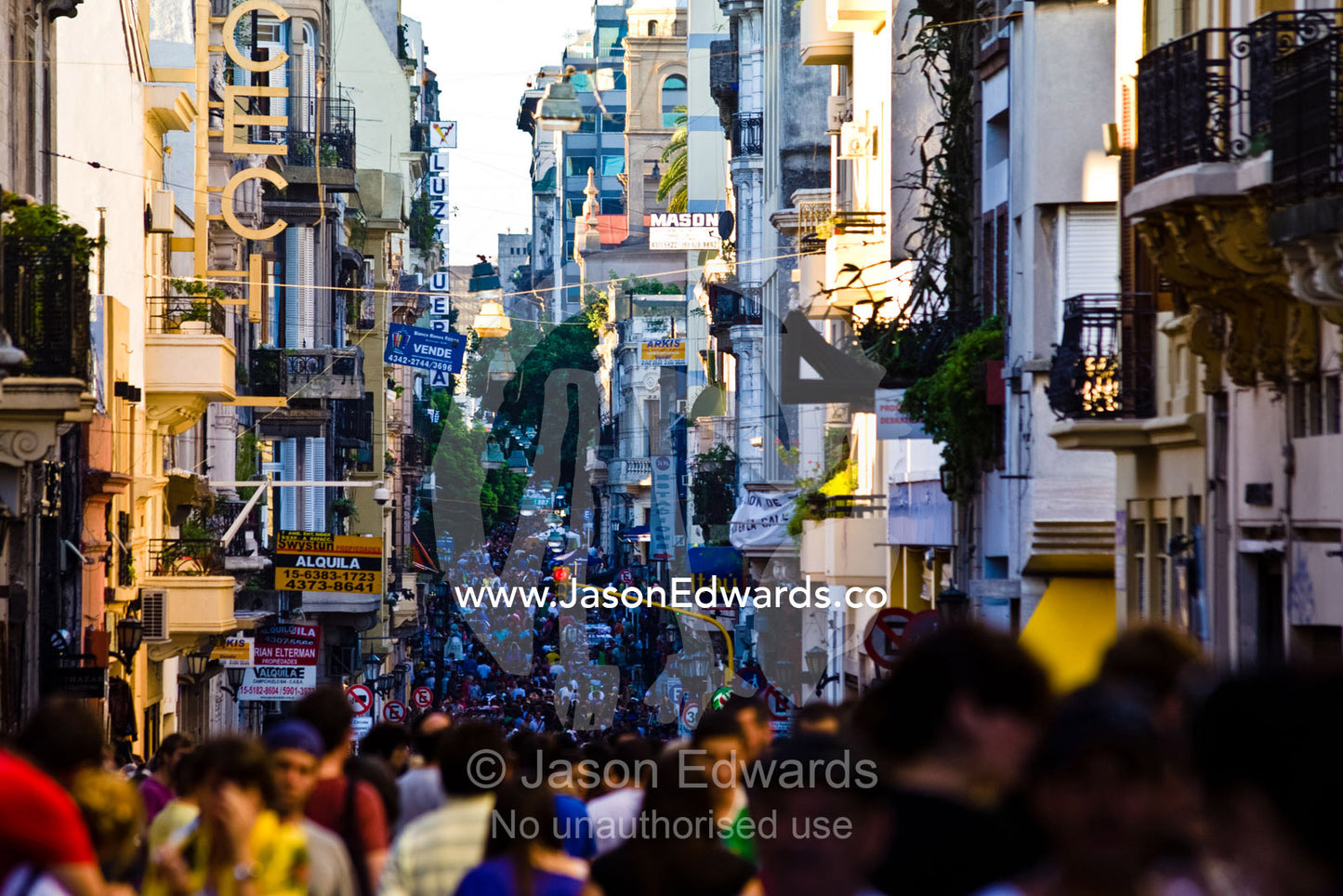 A sea of thousands of people crowd city a street at a weekend market. Calle Defensa, San Telmo, Buenos Aires, Argentina.
