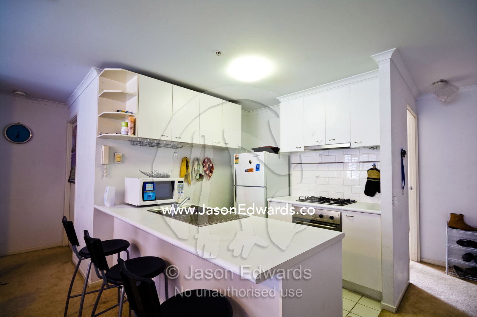 A small kitchen and benchtop in a student's inner city apartment. St Kilda Road, Melbourne, Victoria, Australia.