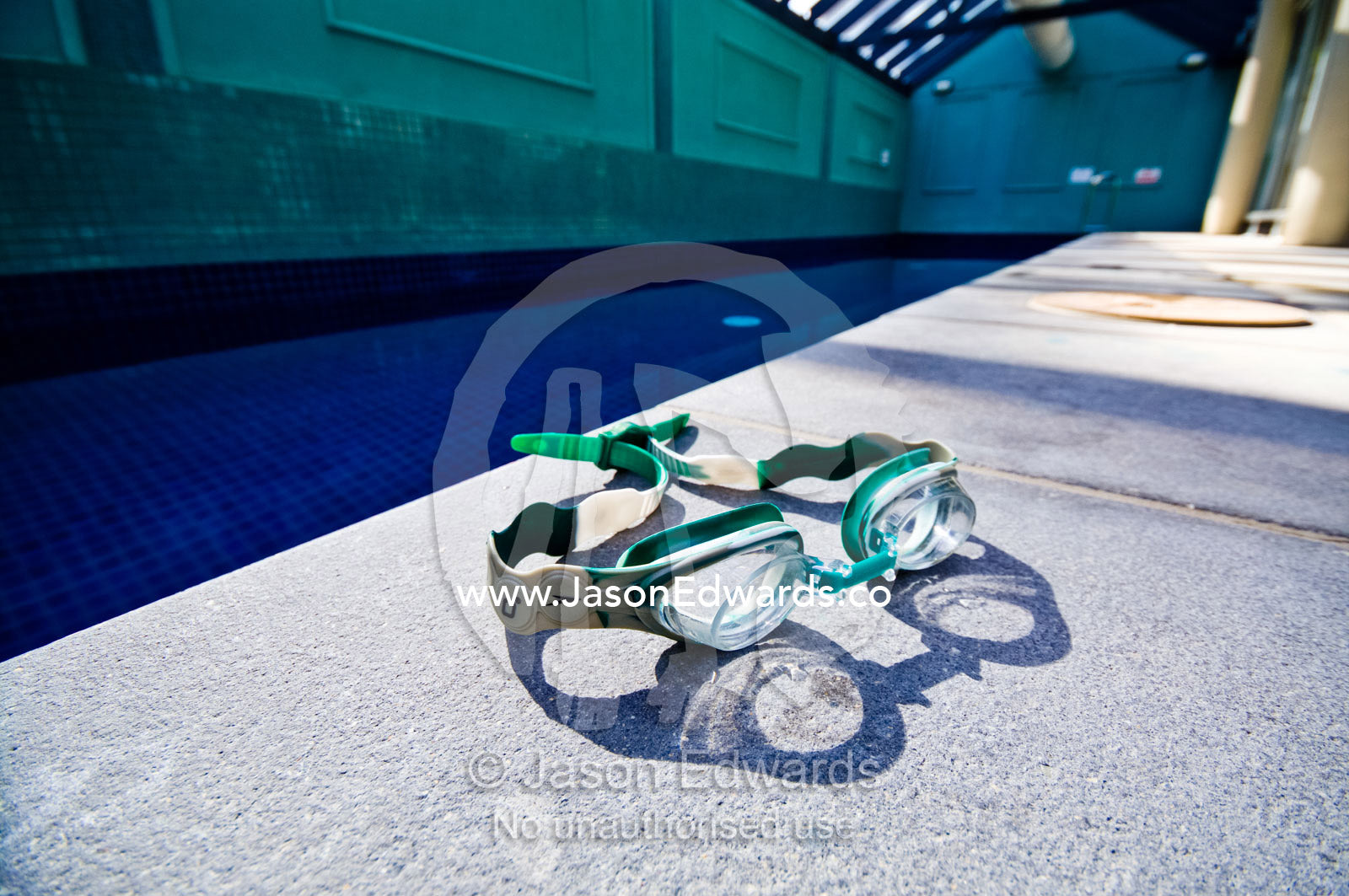Swimming goggles in a private swimming pool in an apartment complex. St Kilda Road, Melbourne, Victoria, Australia.