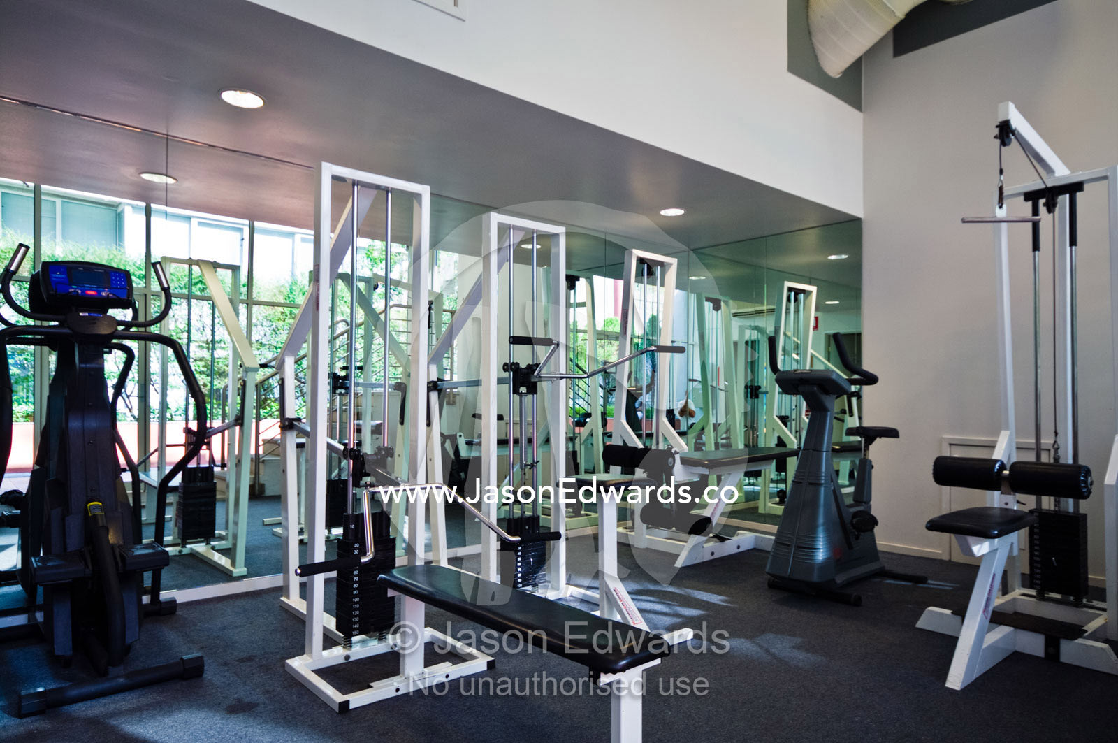 Exercise equipment in a private gymnasium in a city apartment complex. St Kilda Road, Melbourne, Victoria, Australia.