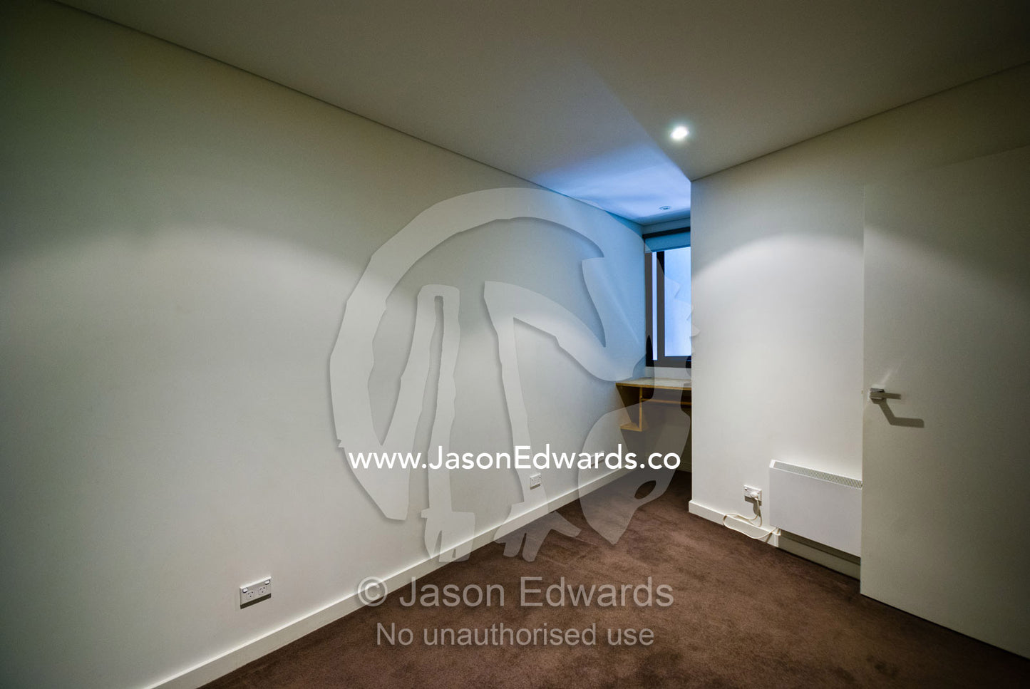 An empty bedroom and lightwell in an uninhabited inner city apartment. North Melbourne, Melbourne, Victoria, Australia.