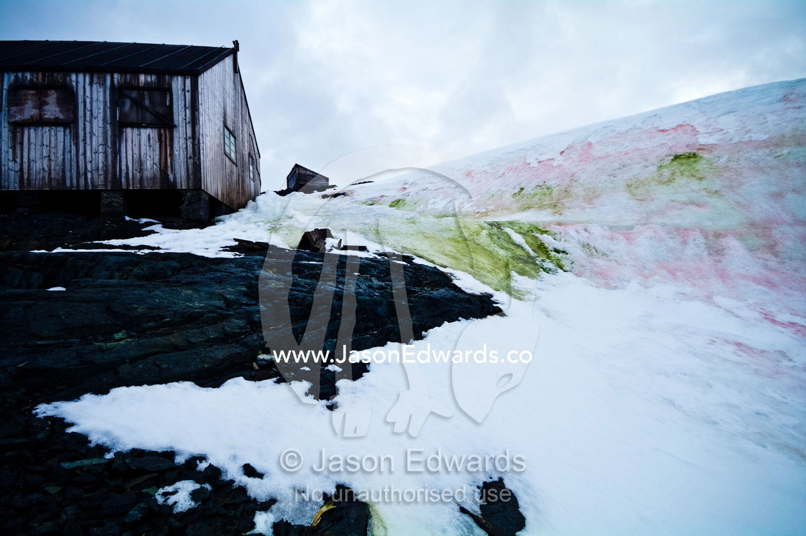 Weathered ruins of an abandoned Antarctic scientific research station. Station W, Detaille Island, Antarctic Peninsula, Antarctic Circle, Antarctica.