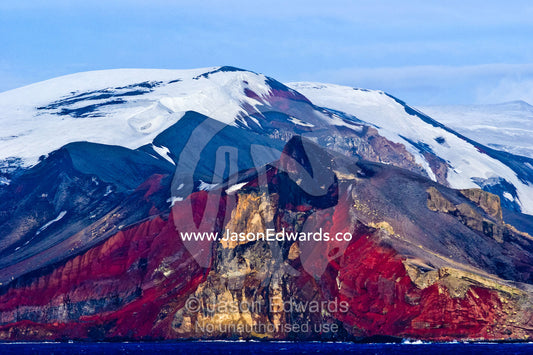 Rugged snow and ice encrusted mountain surrounding a volcanic caldera. Bransfield Strait, Deception Island, South Shetland Islands, Antarctic Peninsula, Antarctica.