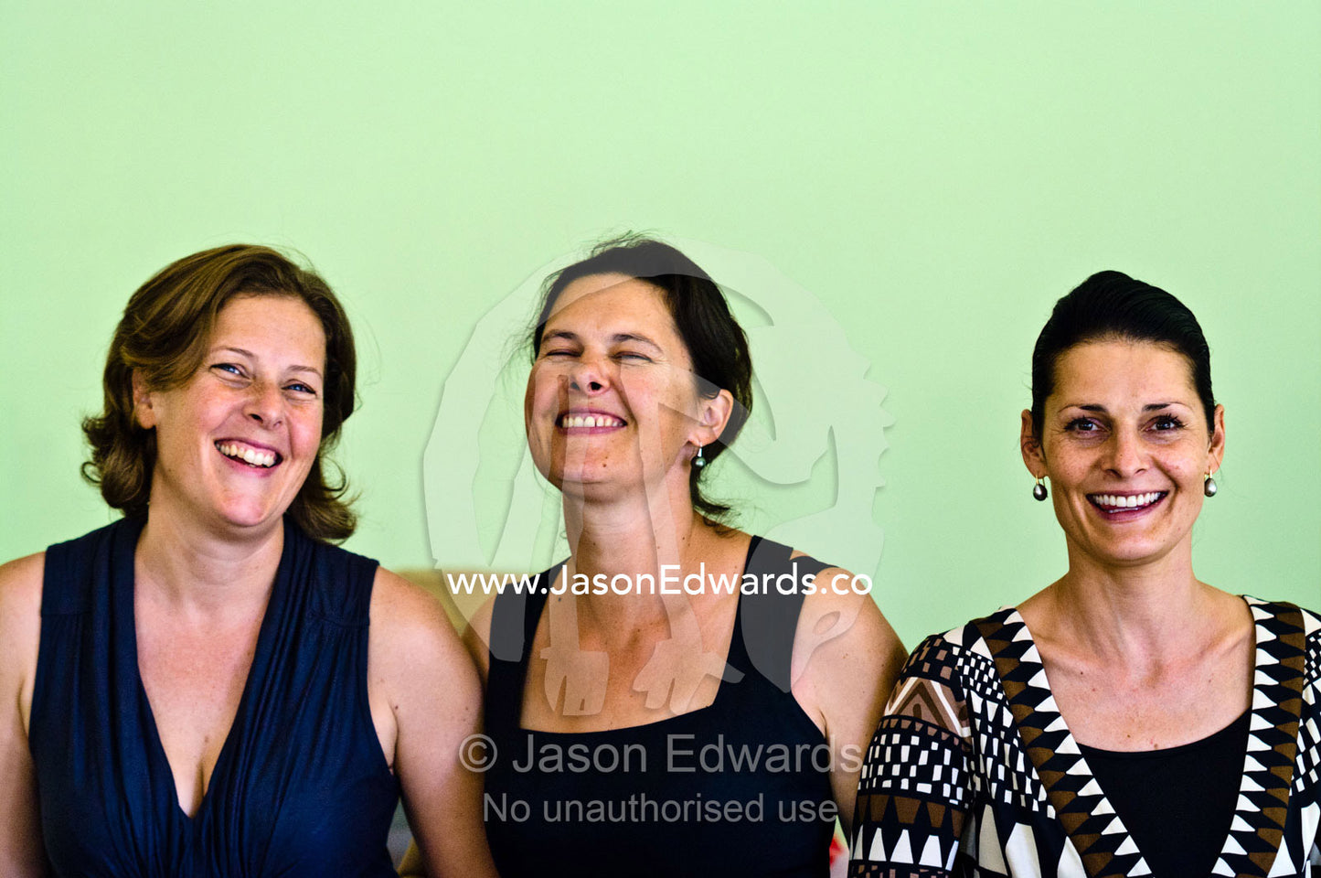 Three sisters posing happily together during a family reunion. Castlemaine, Victoria, Australia.