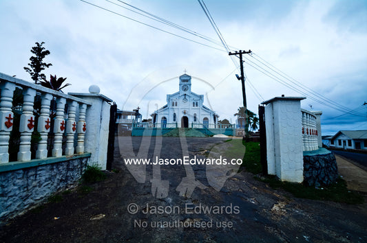 Gates lead to the entrance of St Joseph's Cathedral Catholic Church. Port of Refuge, Neiafu, Vava'u Island Group, Pacific Ocean, Oceania, Kingdom of Tonga.