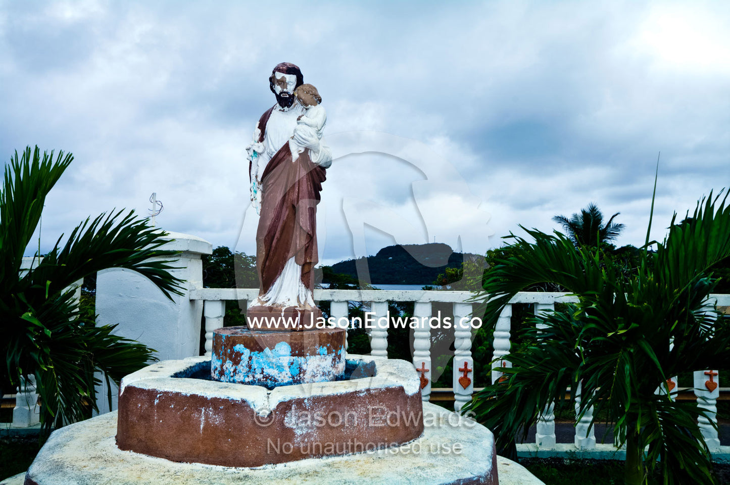 A weathered statue of Christ at St Joseph's Cathedral Catholic Church. Port of Refuge, Neiafu, Vava'u Island Group, Pacific Ocean, Oceania, Kingdom of Tonga.