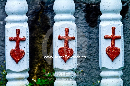 Hearts and crucifix on a fence at St Josephs Cathedral Catholic Church Port of Refuge, Neiafu, Vava'u Island Group, Pacific Ocean, Oceania, Kingdom of Tonga.