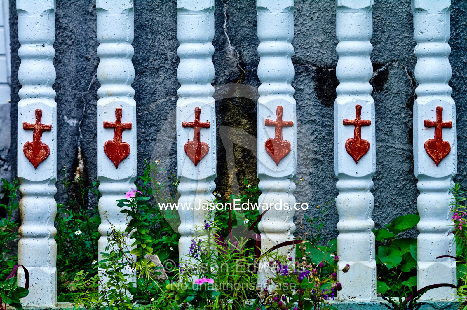 Hearts and crucifix on a fence at St Josephs Cathedral Catholic Church Port of Refuge, Neiafu, Vava'u Island Group, Pacific Ocean, Oceania, Kingdom of Tonga.