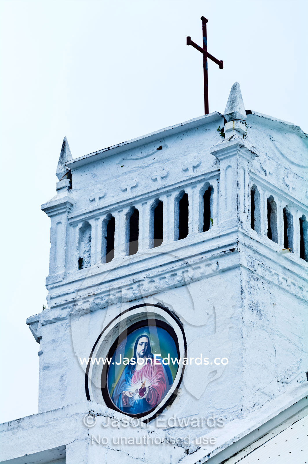 A portrait of Christ on the belfry of St Joseph's Cathedral Church. Port of Refuge, Neiafu, Vava'u Island Group, Pacific Ocean, Oceania, Kingdom of Tonga.
