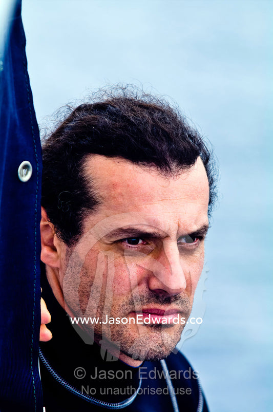 An unshaven man searches the horizon whilst whale watching from a boat Vava'u Island Group, Pacific Ocean, Oceania, Kingdom of Tonga.