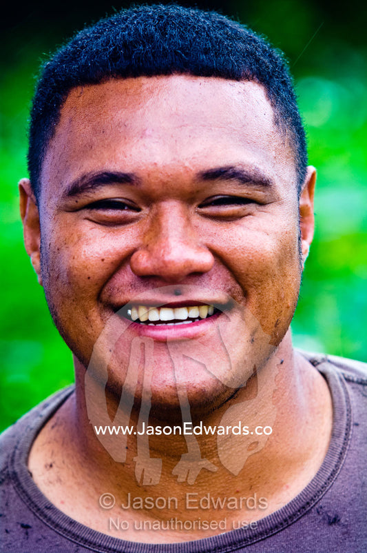 A smiling well-groomed Tongan man after a shave and haircut. Port of Refuge, Neiafu, Vava'u Island Group, Pacific Ocean, Oceania, Kingdom of Tonga.