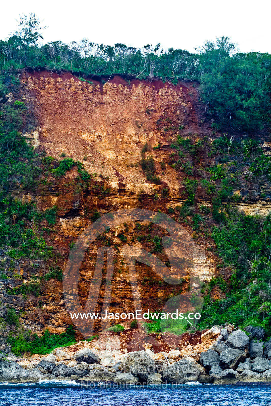 A landslide and erosion on the cliff face of a limestone island. Vava'u Island Group, Pacific Ocean, Oceania, Kingdom of Tonga.