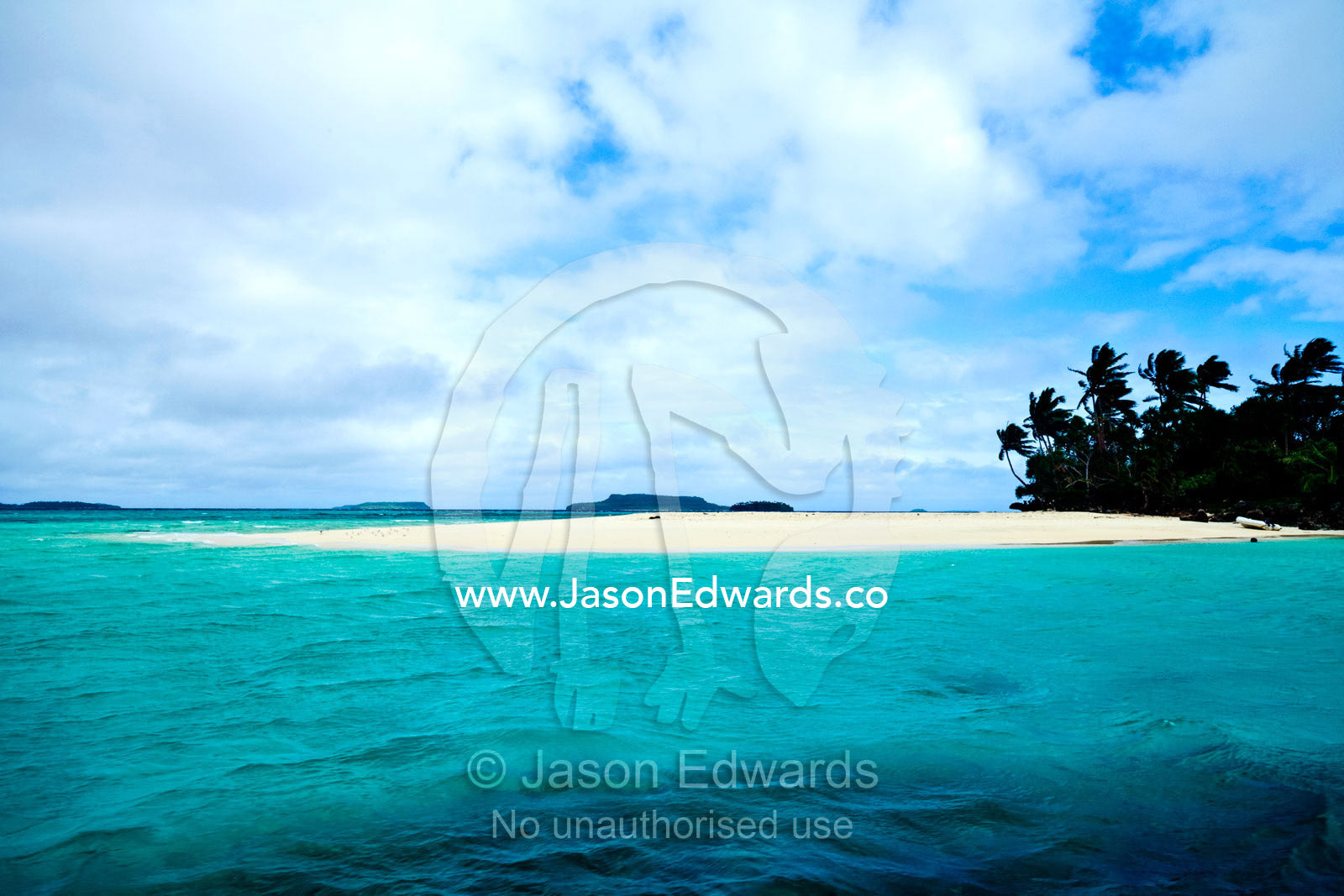 A white sandy beach on an uninhabited remote tropical island. Vava'u Island Group, Pacific Ocean, Oceania, Kingdom of Tonga.