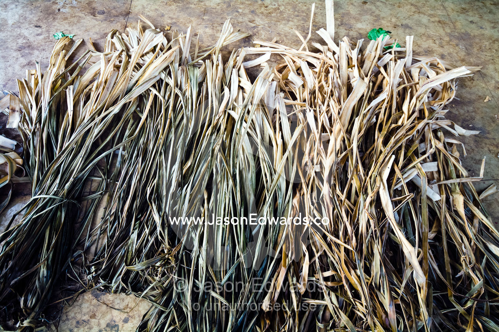 Tapa leaves from the paper-mulberry tree laid flat and dried for sale. Utukalongalu Market, Port of Refuge, Neiafu, Vava'u Island Group, Pacific Ocean, Oceania, Kingdom of Tonga.