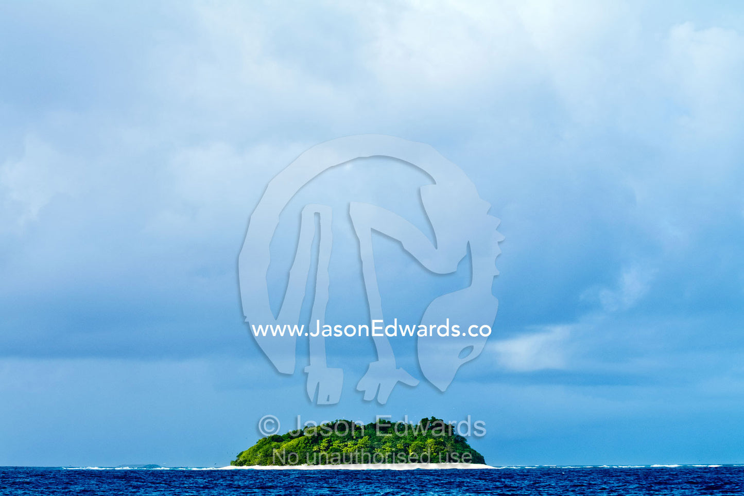 Rainforest rises above white sandy beaches on a remote idyllic island. Vava'u Island Group, Pacific Ocean, Oceania, Kingdom of Tonga.