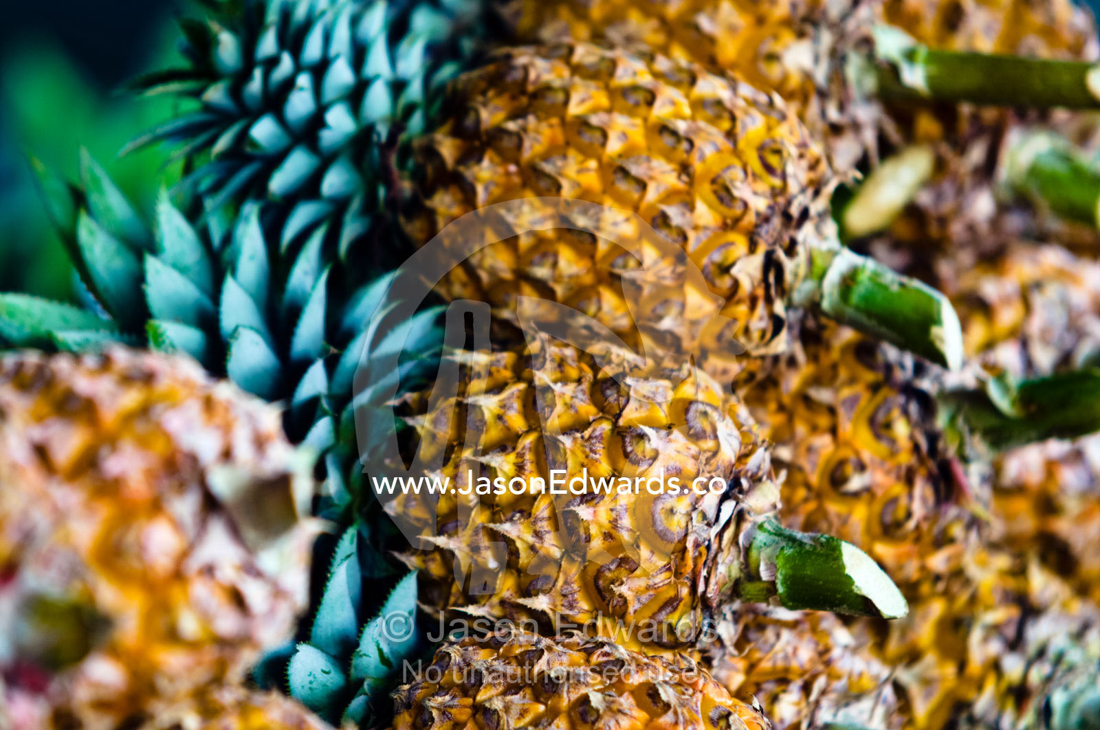 A stack of healthy ripe fresh pineapples for sale at a rural market. Utukalongalu Market, Port of Refuge, Neiafu, Vava'u Island Group, Pacific Ocean, Oceania, Kingdom of Tonga.