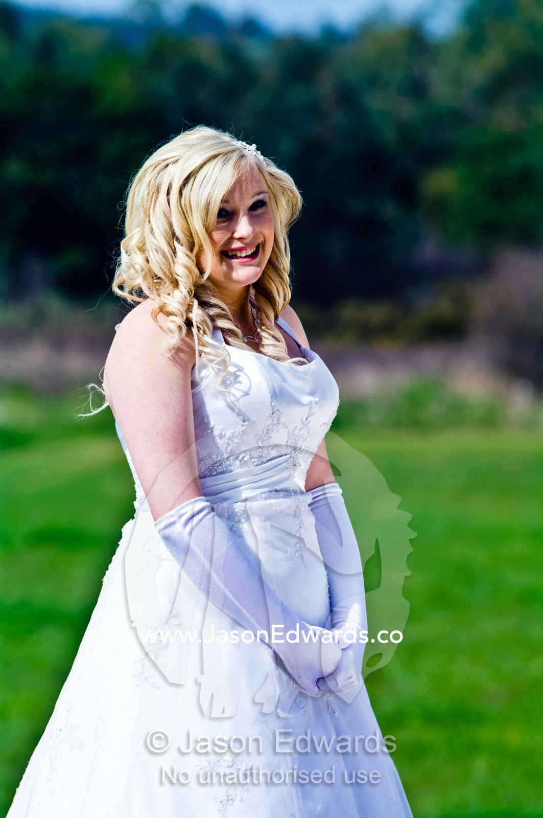 A teenage girl prepares to attend her debutante ball in a white dress. Melbourne, Victoria, Australia.