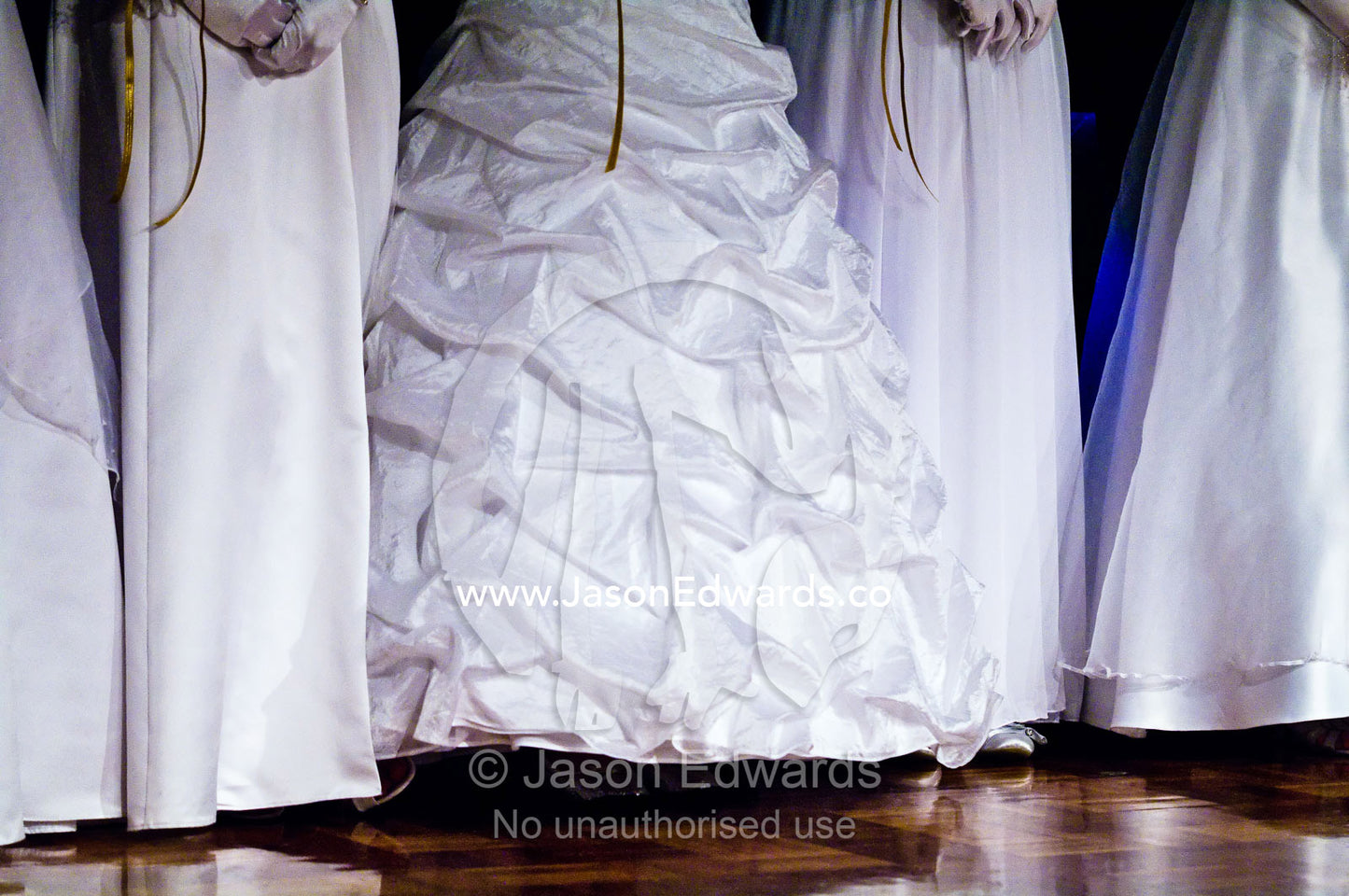 Teenage girls in white dresses on the dance floor at a debutante ball. Melbourne, Victoria, Australia.