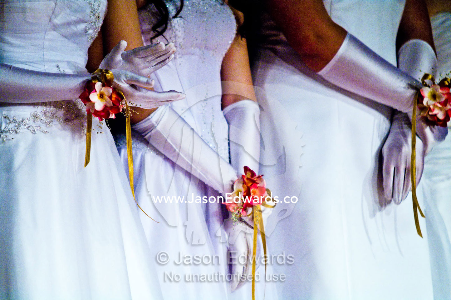 Teenage girls in white dresses on the dance floor at a debutante ball. Melbourne, Victoria, Australia.