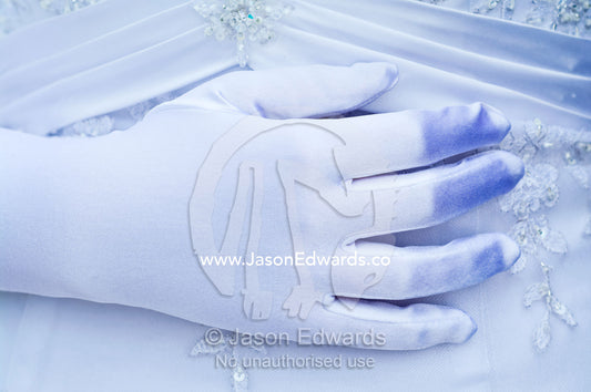 A teenage girl prepares to attend her debutante ball in a white dress. Melbourne, Victoria, Australia.