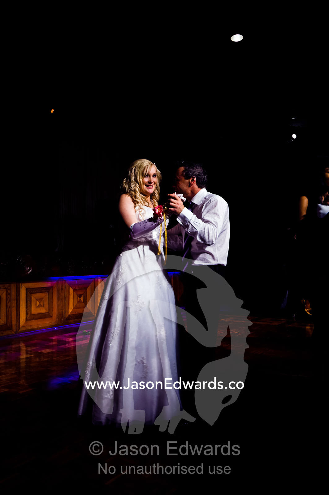 A teenage girl dances with her father at a debutante ball. Melbourne, Victoria, Australia.